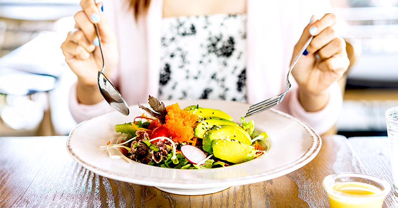 woman eating a nutritious salad